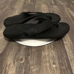 Brand new only tried on. Olukai black leather sandals